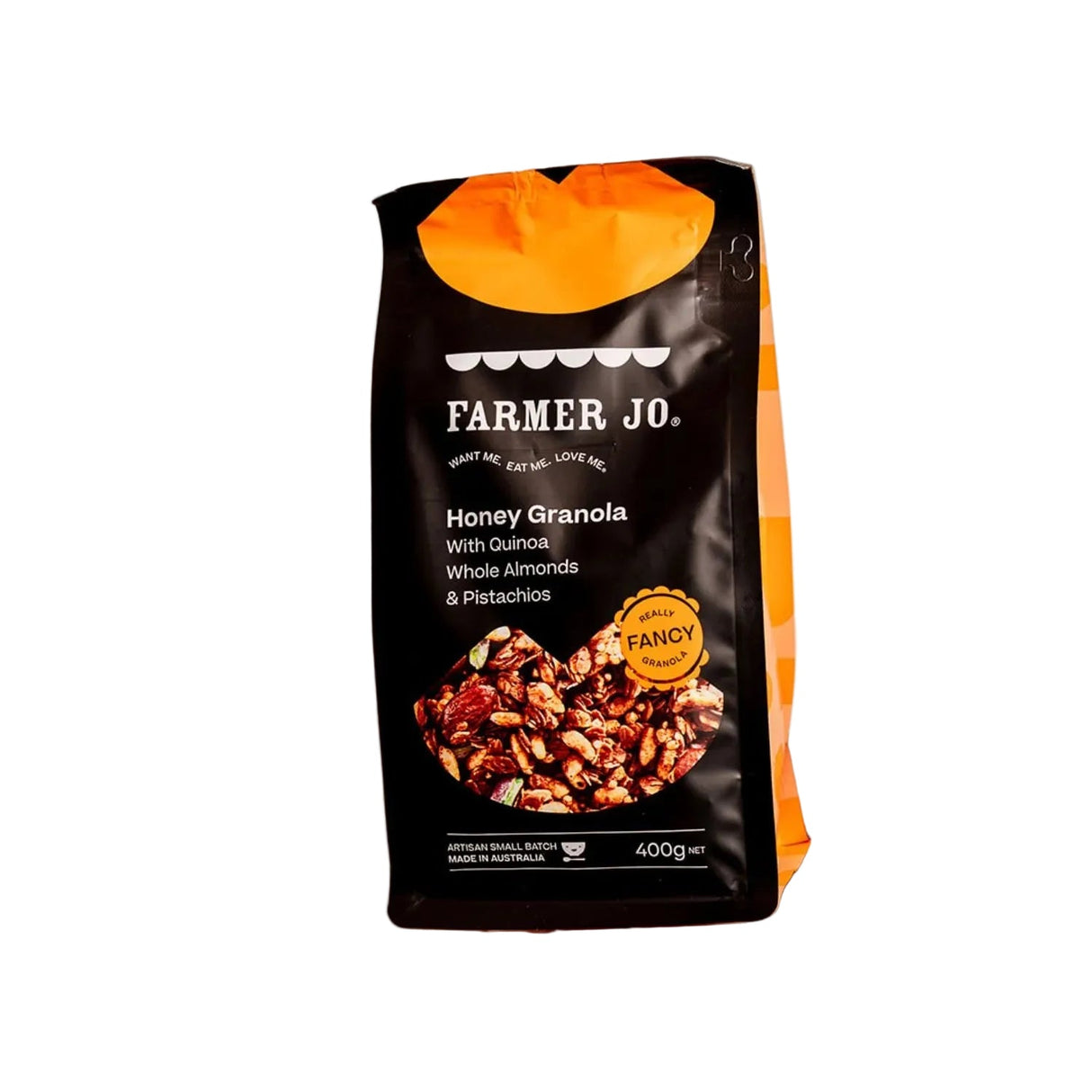 Hand holding a package of Farmer Jo Honey Granola with Quinoa, Whole Almonds, and Pistachios.
