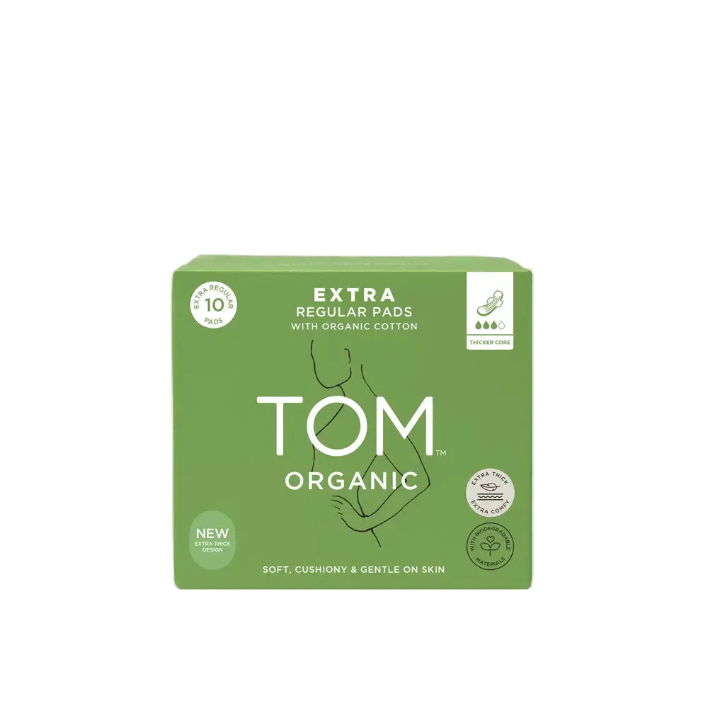 Green box of TOM Organic extra regular pads on a light gray background