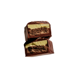 Loco Love Peppermint Cookie Crunch bar cut open showing the peppermint and cookie centre